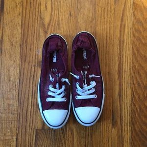 Women’s size 8.5 burgundy red Converse shoes.